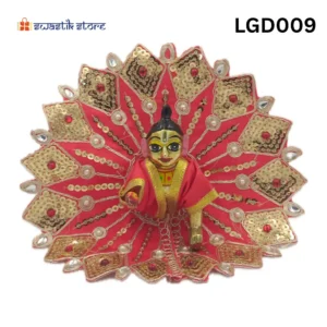 Decorative Indian festival idol with red and gold sequin fan backdrop; small golden figure in center.