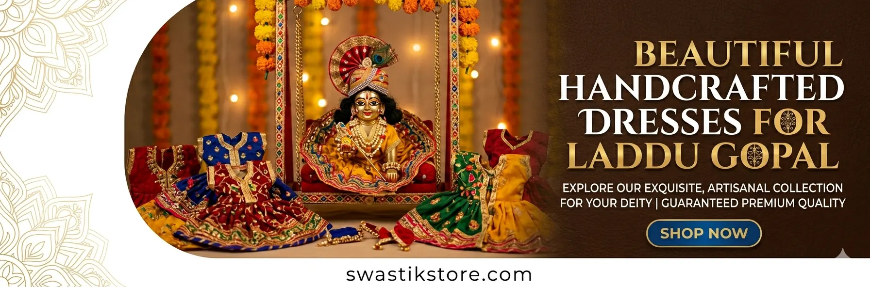 Statue of Laddu Gopal in a decorated cradle surrounded by colorful handcrafted dresses; ornate backdrop and marigold garlands, promoting the swastikstore.com collection.